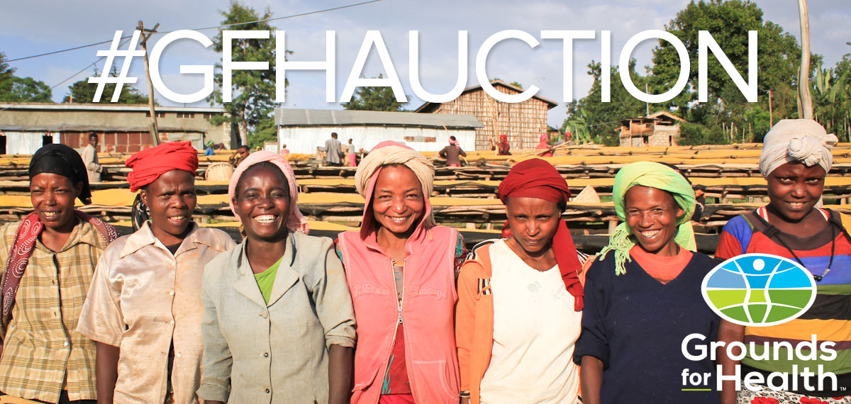Women from a coffee-growing community standing in front of drying beds, Grounds for Health auction banner