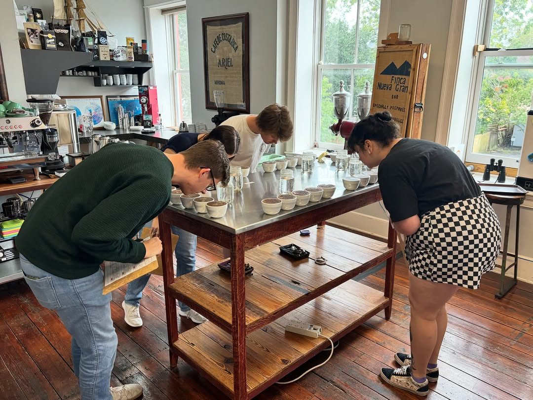 The Balzac Brothers team cupping coffee in the Charleston lab